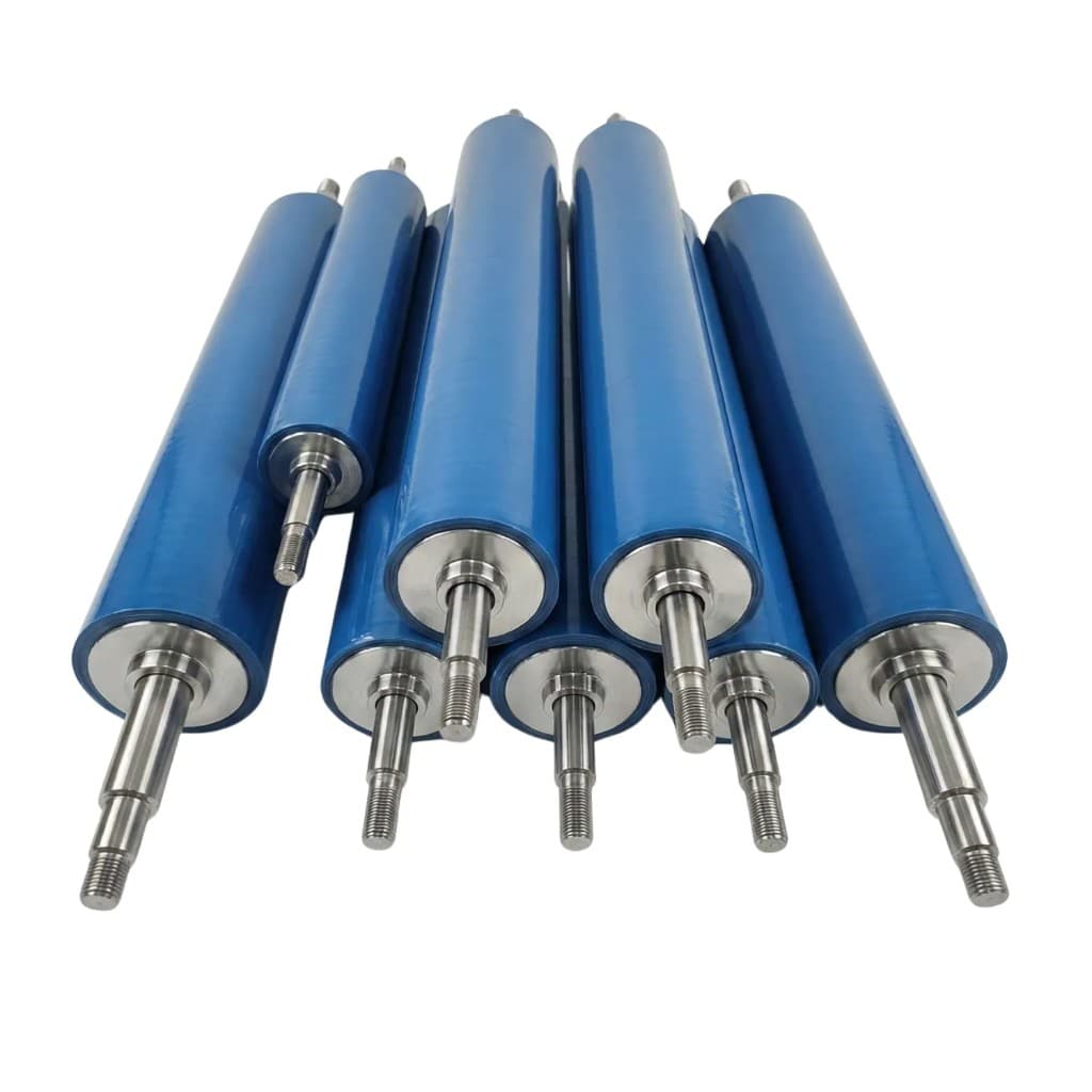 Group of blue polyurethane industrial rollers with metal shafts on white background
